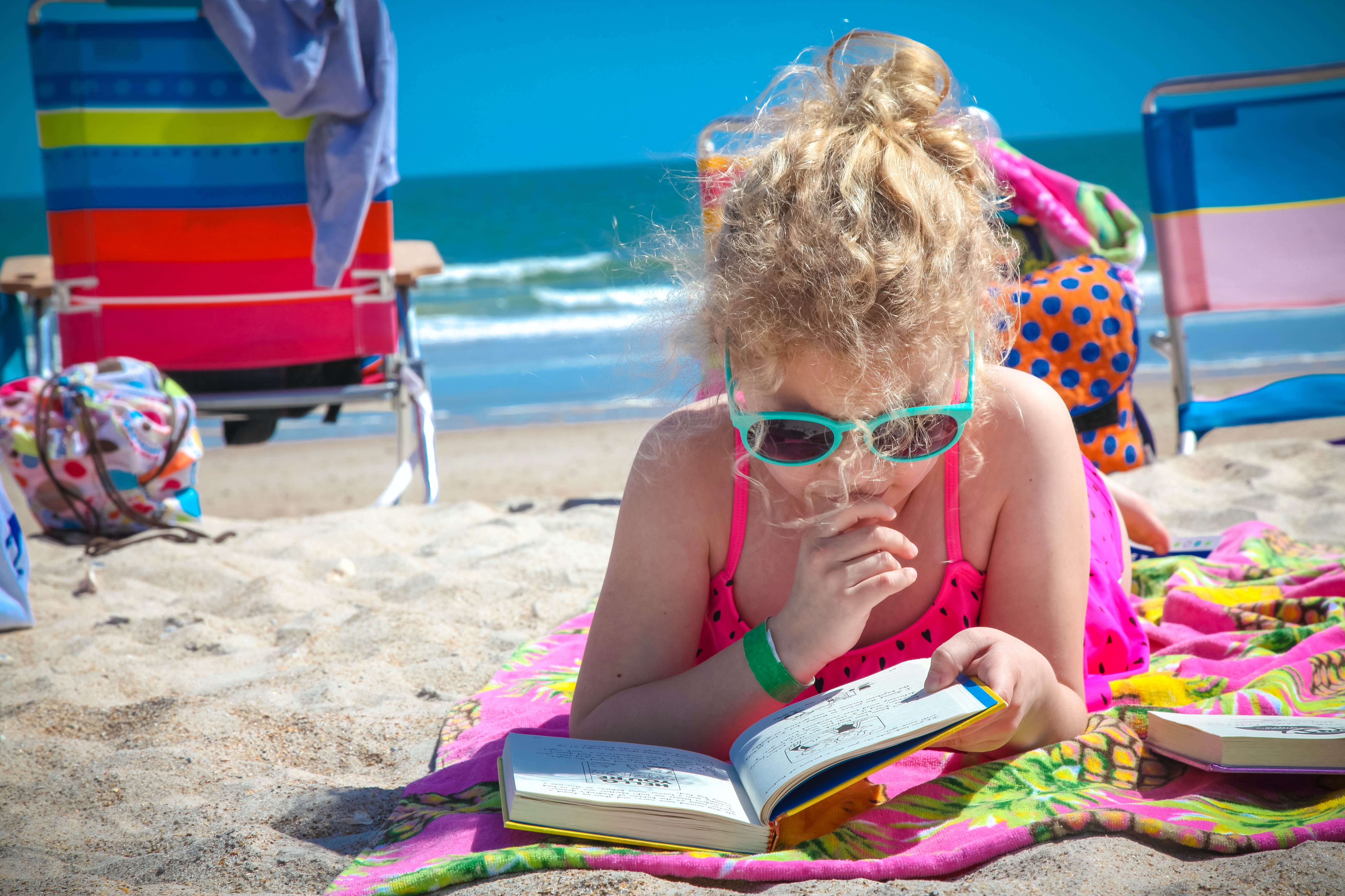 Girl Reading on Beach